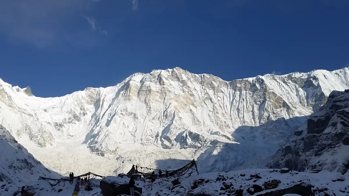 Sunrise on Annapurna I, seen from base camp with prayer flags