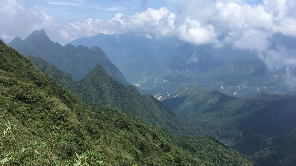 The Hoang Lien Son mountains with clouds over the valley