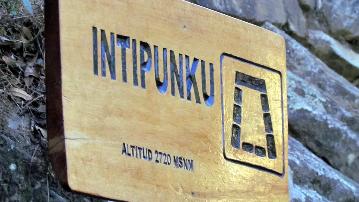 Sign at Inti Punku, the Sun Gate at 2,720 m