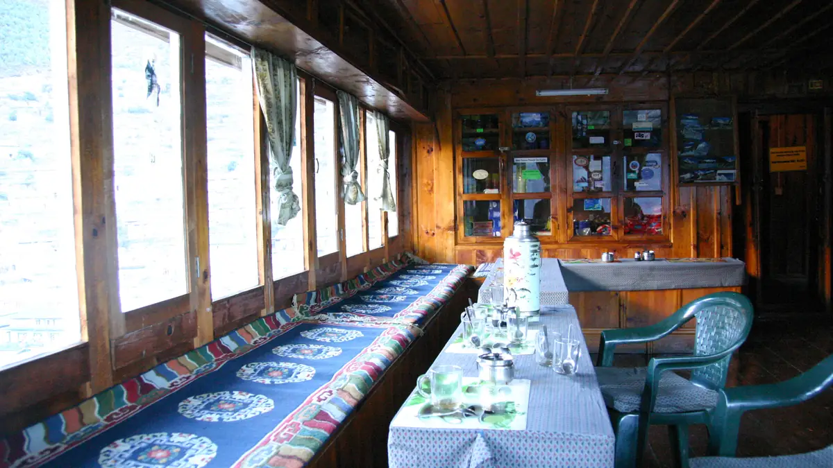 Dining room of a lodge in Namche with a window front