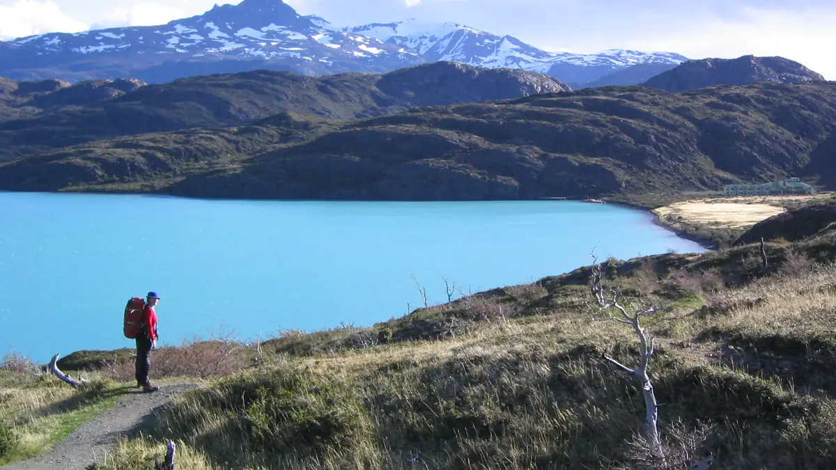 Hiker with backpack on the trail above Lago Pehoé