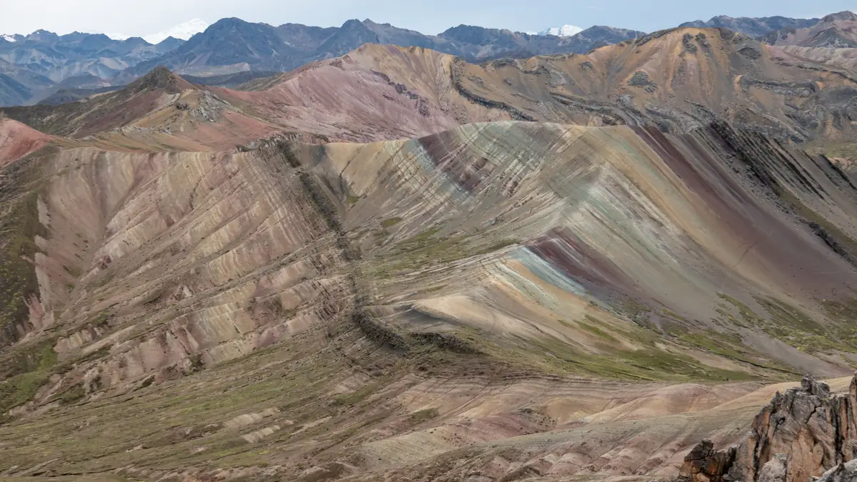 The striped ridges of Palccoyo, the Vilcanota range behind