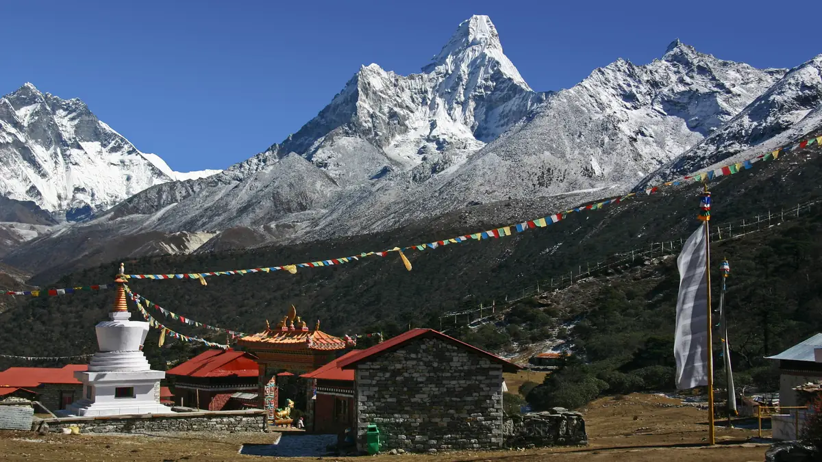 Tengboche Monastery with prayer flags before Lhotse and Ama Dablam