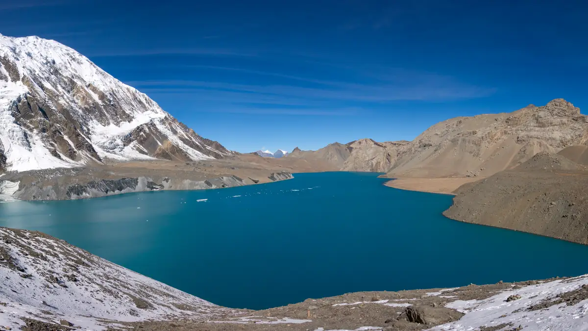 Tilicho Lake at 4,919 m below snow-covered slopes